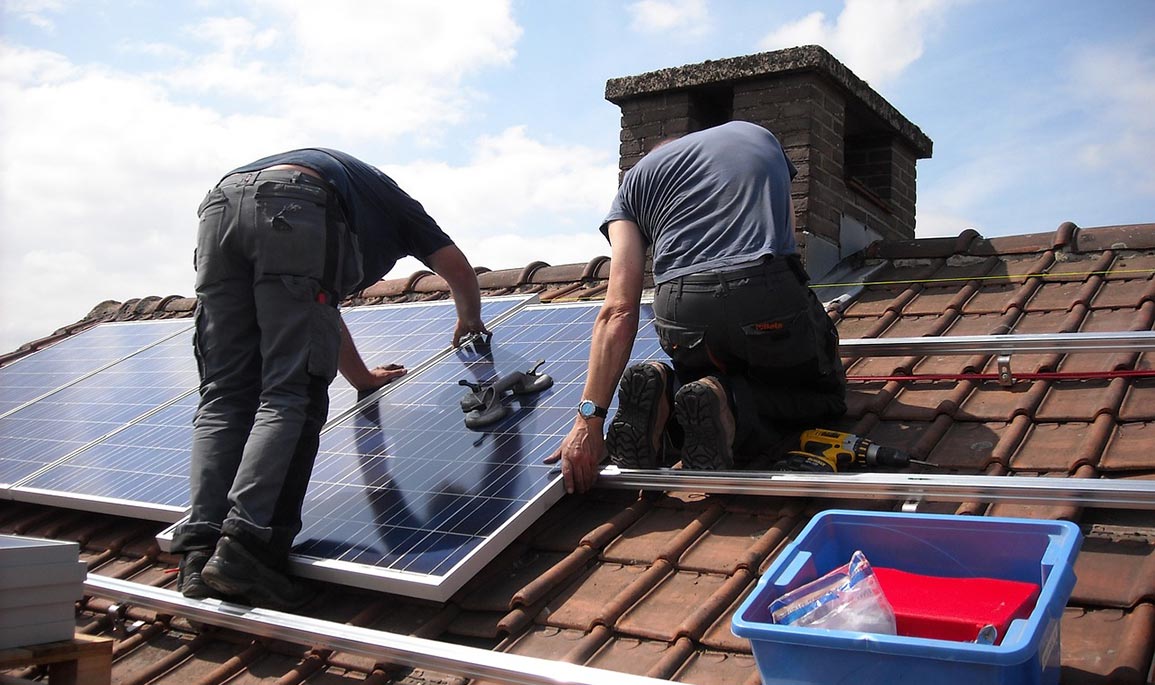 solar panels being fitted on a roof