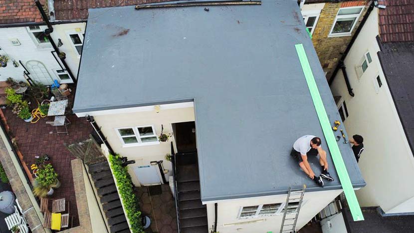 roofers working on a flat roof