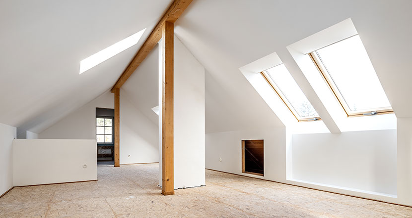 inside a finished empty loft conversion with windows